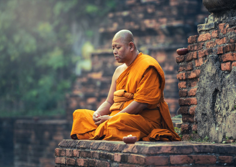 A Monk meditating at a relic site